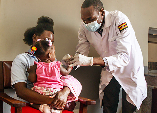 doctor with child and adult